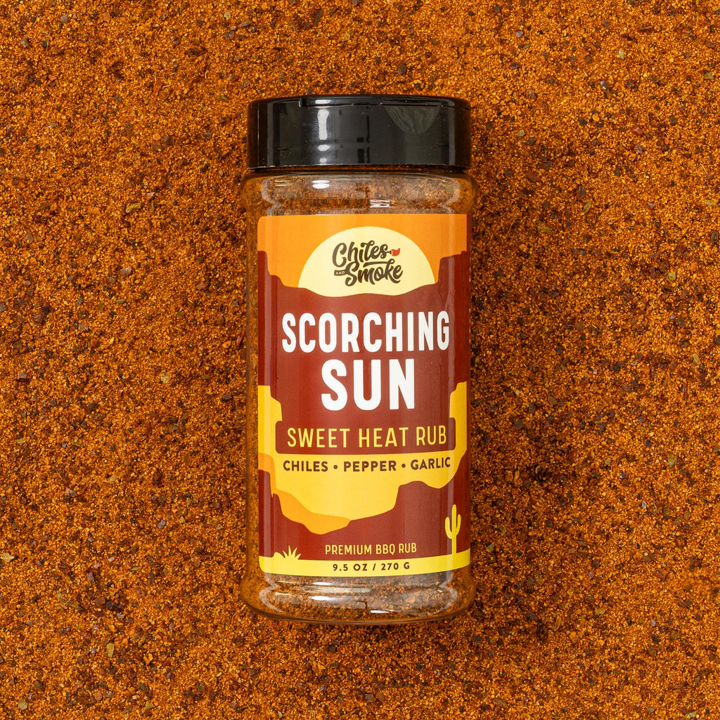 Chiles and Smoke Scorching Sun Sweet Heat Rub bottle and spices